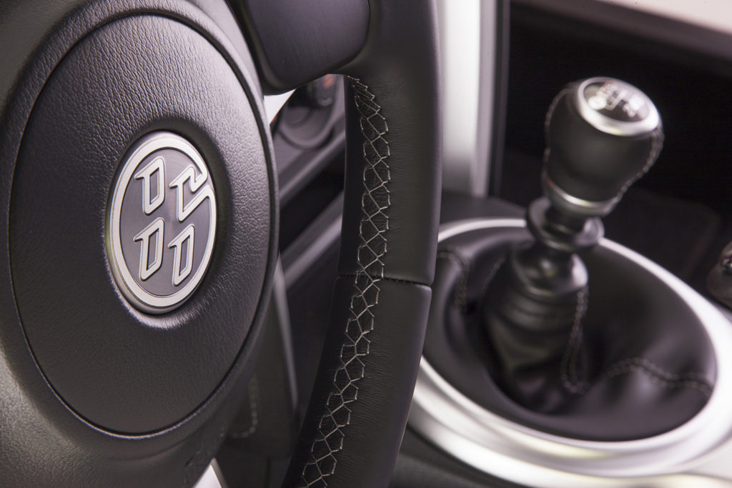 Eye-catching “86” badging shows off this car’s new name in its driver-focused cabin.